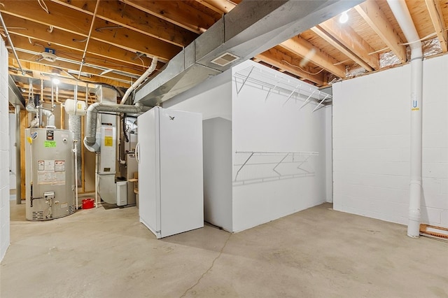 basement featuring heating unit and gas water heater