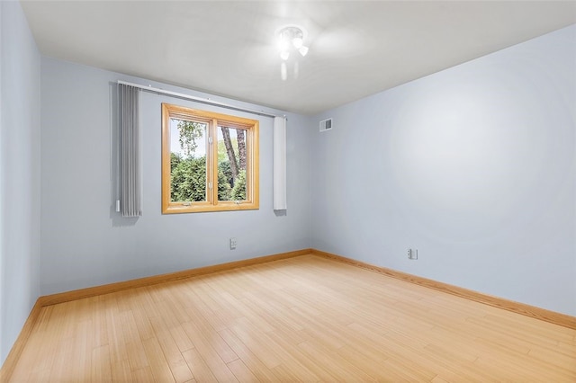 unfurnished room with light hardwood / wood-style floors