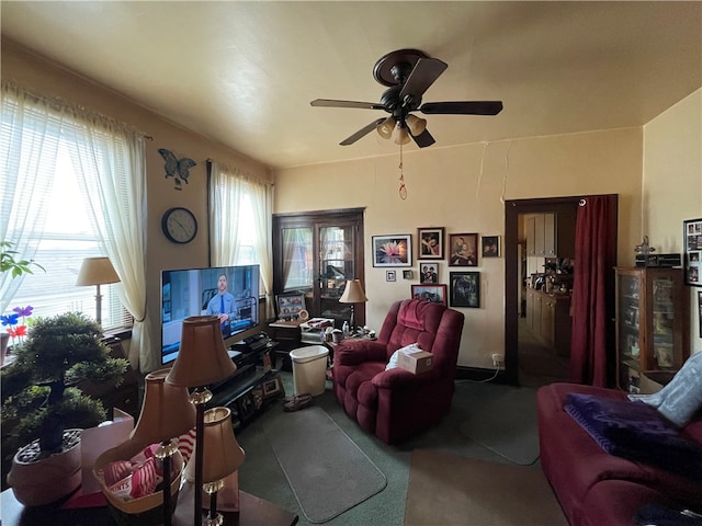 living room with a healthy amount of sunlight and ceiling fan