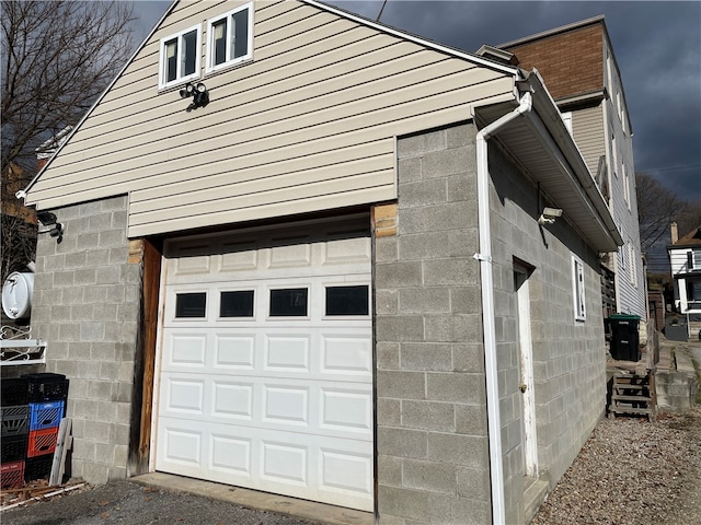 view of property exterior with a garage