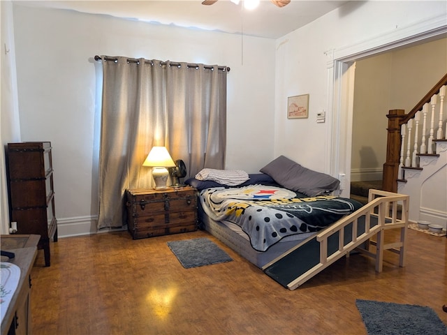 bedroom with hardwood / wood-style flooring and ceiling fan