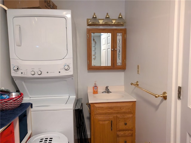 laundry area featuring sink and stacked washer and dryer