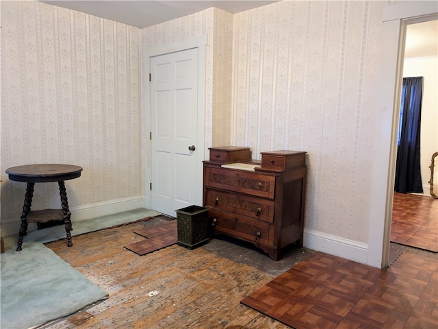 living area featuring dark parquet floors