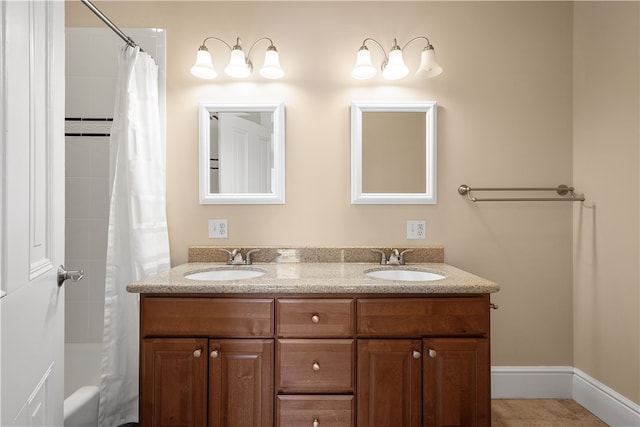 bathroom featuring a shower with shower curtain and vanity