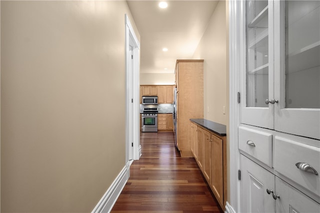 corridor featuring dark wood-type flooring