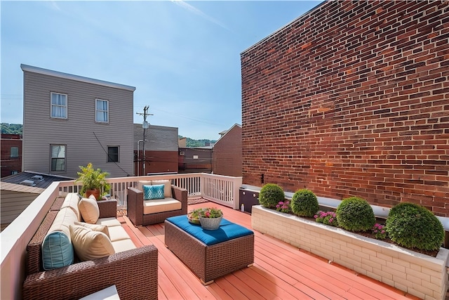 wooden deck featuring an outdoor hangout area