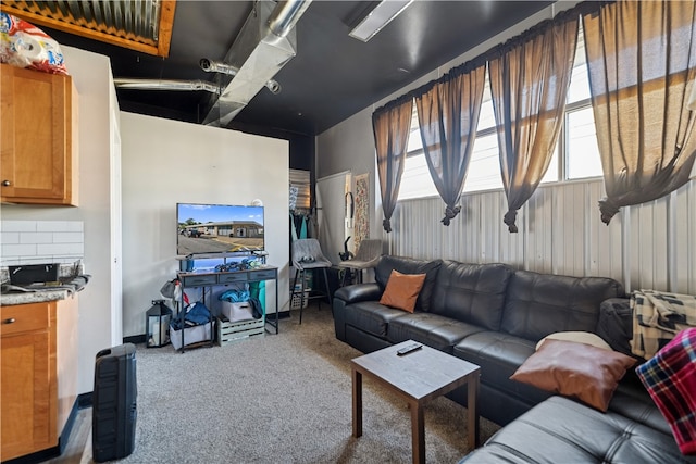 carpeted living room featuring a healthy amount of sunlight