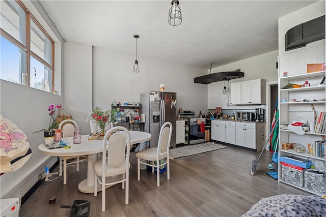 dining area with dark hardwood / wood-style floors