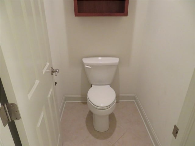 bathroom with tile patterned floors and toilet