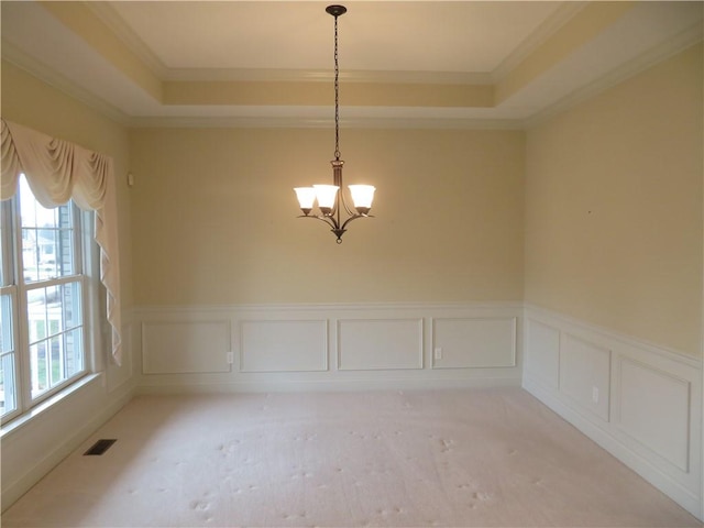 unfurnished dining area featuring light colored carpet, plenty of natural light, and ornamental molding