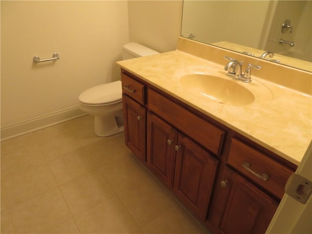 bathroom with tile patterned floors, vanity, and toilet