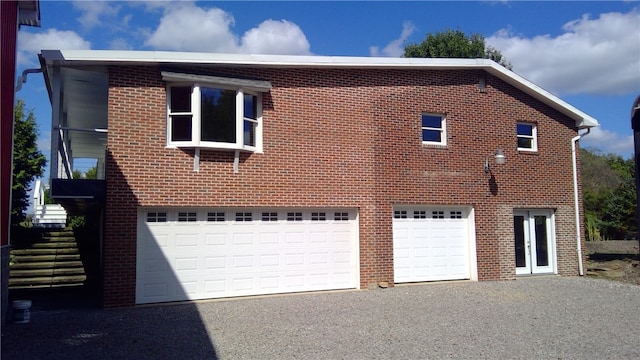 view of side of home with a garage