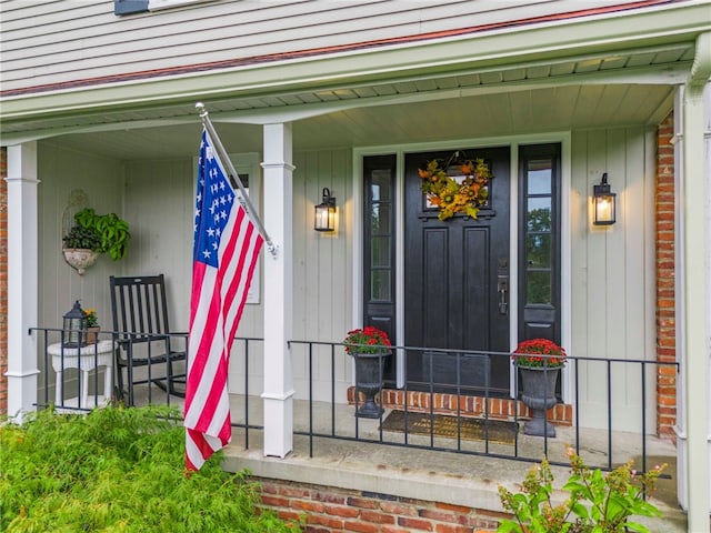 doorway to property featuring a porch