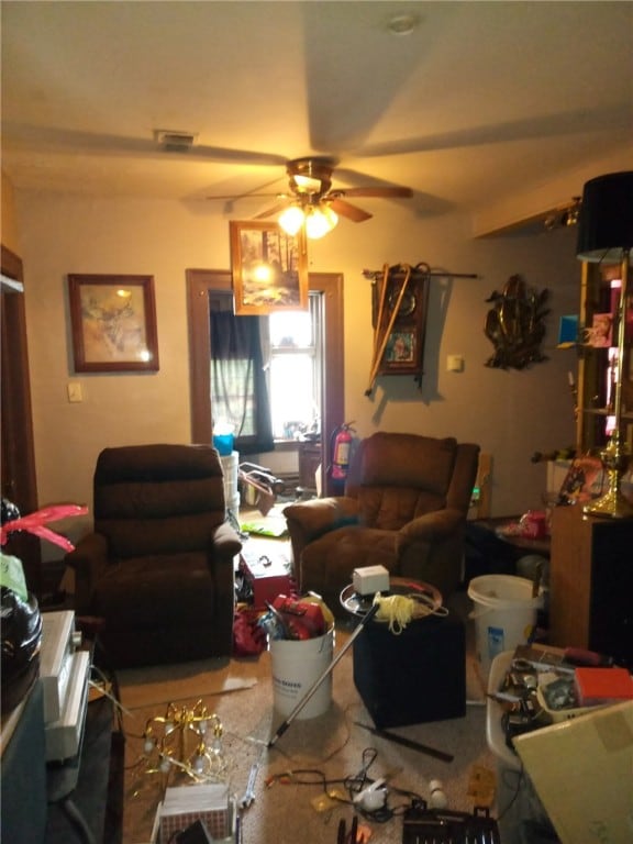 living room featuring beam ceiling and ceiling fan