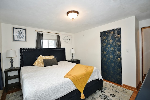 bedroom with wood-type flooring