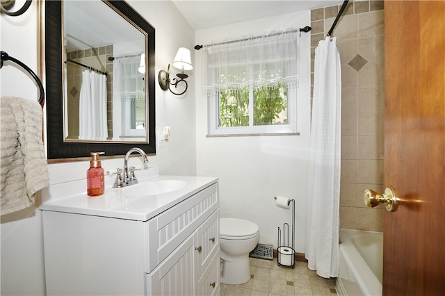 full bathroom with shower / bath combo, vanity, and toilet