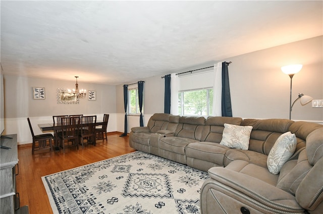 living room featuring a chandelier and hardwood / wood-style floors