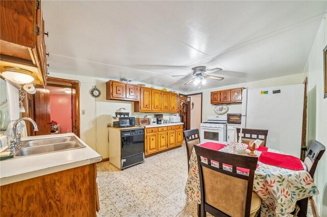 kitchen with black appliances, ceiling fan, and sink