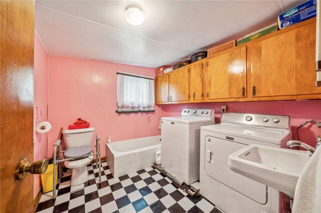 laundry room featuring washer and clothes dryer and sink