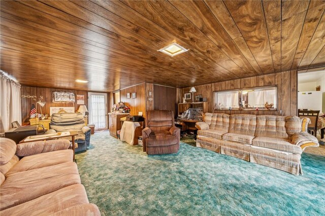 living room with wood walls, carpet, and wooden ceiling