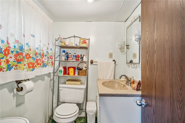 bathroom with vanity and toilet