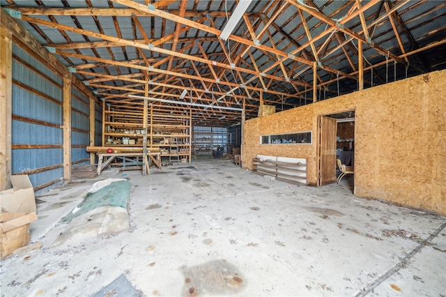 miscellaneous room featuring high vaulted ceiling