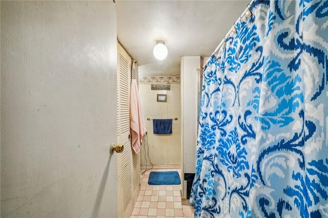 bathroom with tile patterned flooring