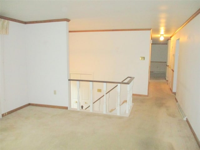 interior space with ornamental molding and light colored carpet