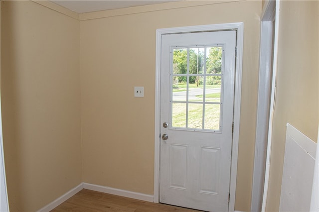 doorway with hardwood / wood-style floors