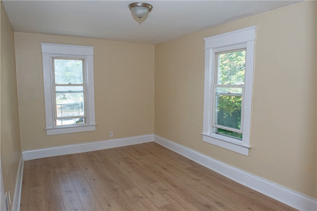 spare room with light hardwood / wood-style flooring