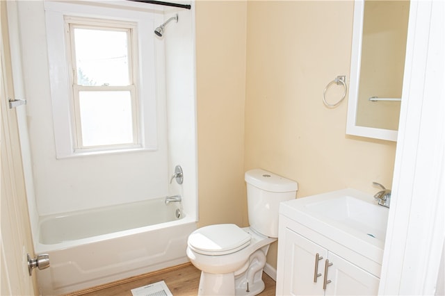 full bathroom with  shower combination, vanity, toilet, and hardwood / wood-style flooring