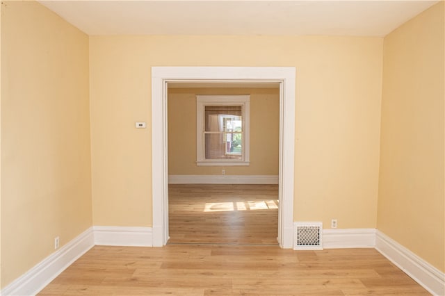 unfurnished room with light hardwood / wood-style flooring