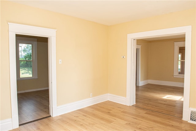 spare room with light wood-type flooring