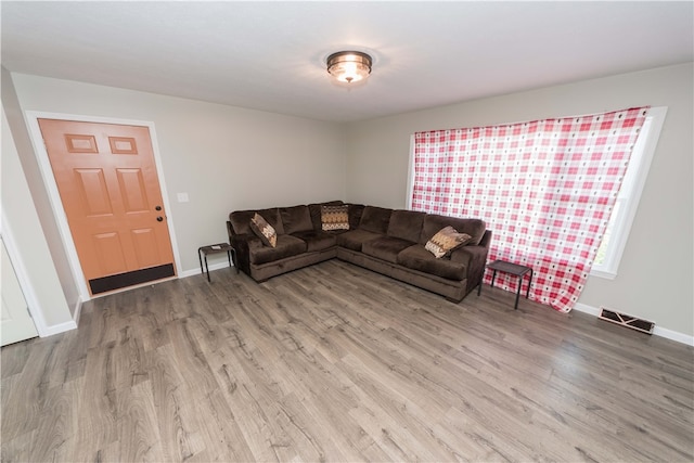 living room with light hardwood / wood-style floors