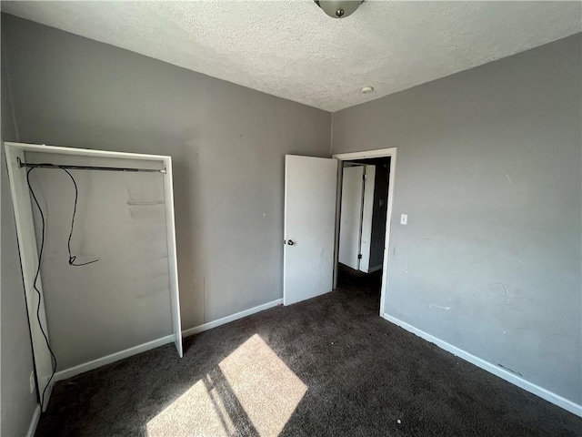 2323 Patterson Ave, Swissvale, PA 15218 - unfurnished bedroom featuring a textured ceiling, carpet flooring, and baseboards