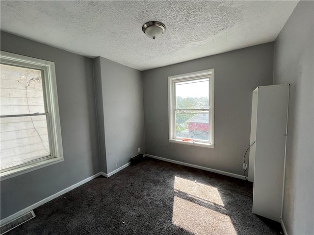 2323 Patterson Ave, Swissvale, PA 15218 - carpeted spare room featuring a textured ceiling and baseboards