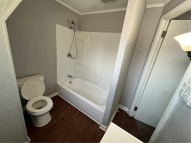 2323 Patterson Ave, Swissvale, PA 15218 - bathroom with wood finished floors, toilet, a textured wall, bathtub / shower combination, and crown molding