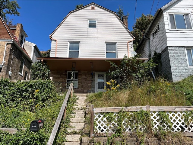 2323 Patterson Ave, Swissvale, PA 15218 - view of front of property featuring a porch, a gambrel roof, and stairs