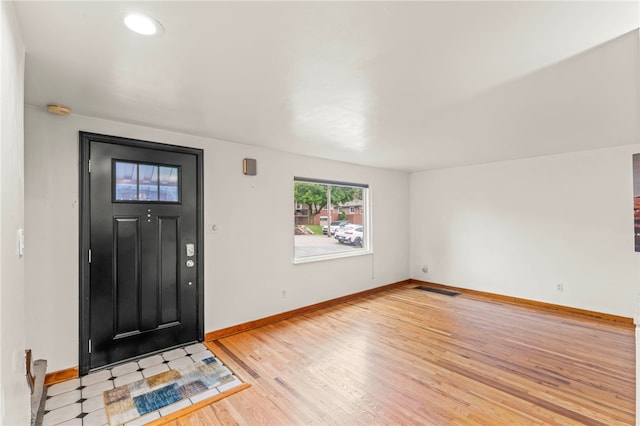 entryway with light hardwood / wood-style floors