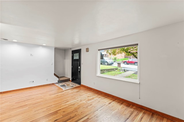 spare room with light wood-type flooring