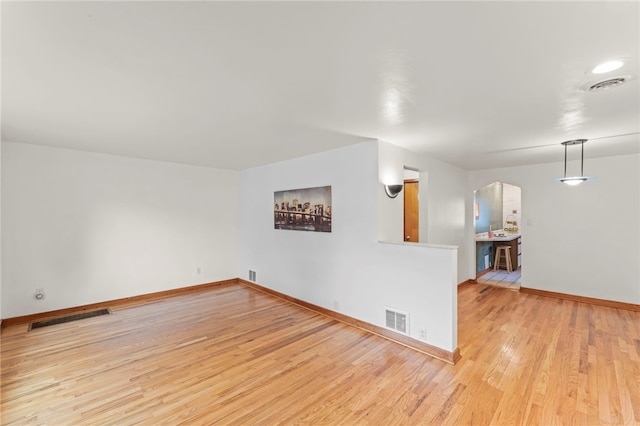 unfurnished living room featuring light hardwood / wood-style floors