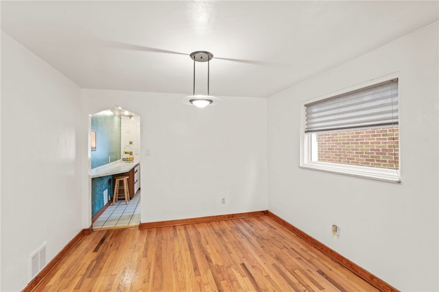 spare room with light wood-type flooring