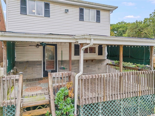 exterior space with ceiling fan and a deck