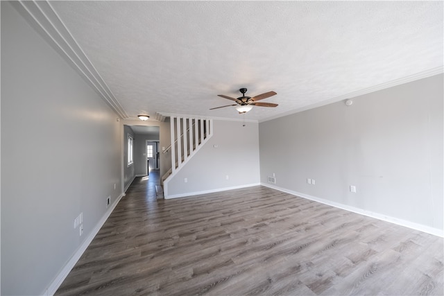 unfurnished room with ceiling fan, hardwood / wood-style flooring, ornamental molding, and a textured ceiling