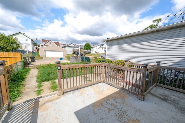 view of patio / terrace with an outbuilding and a garage