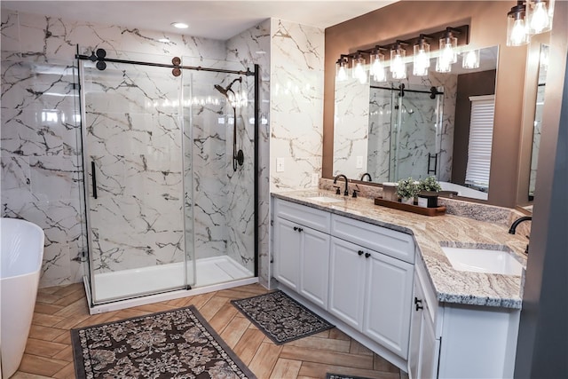 bathroom featuring separate shower and tub and vanity