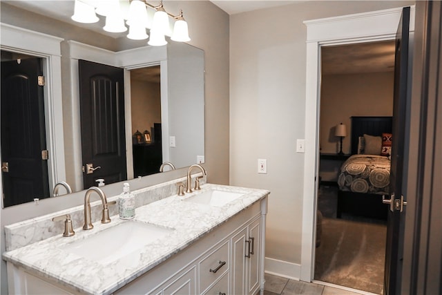 bathroom featuring tile patterned flooring and vanity