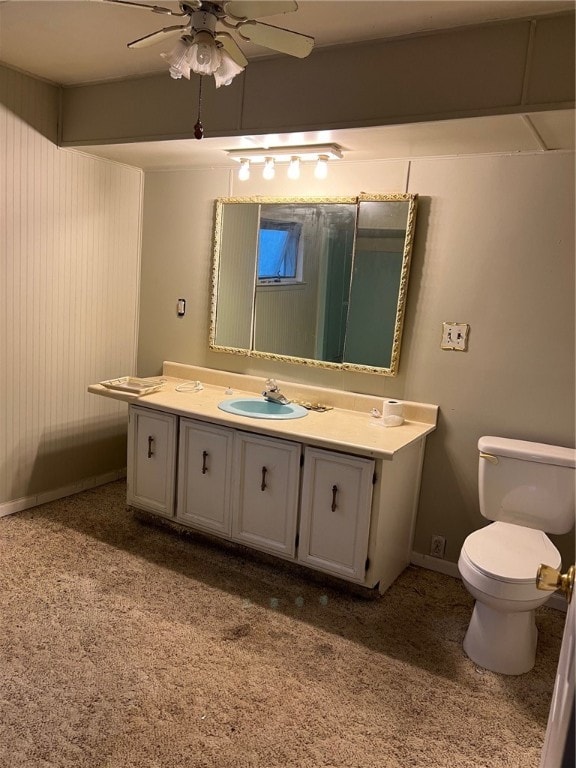 bathroom featuring vanity, toilet, and ceiling fan