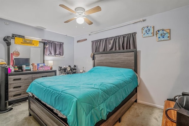 bedroom with ceiling fan and light colored carpet