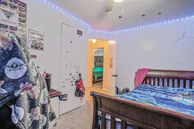 bedroom featuring ceiling fan and light colored carpet